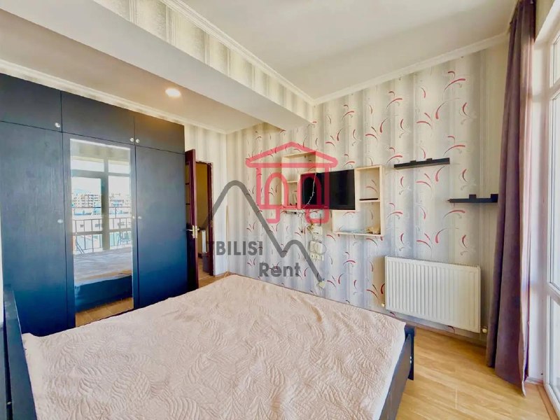 A bright and cozy two-bedroom apartment in a new building, featuring a spacious living room and a balcony. It has a well-designed layout, a modern kitchen, and everything you need for a comfortable life—central heating, an air conditioner, and a dishwasher. — фото 5