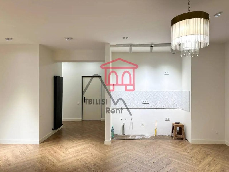 A spacious, newly renovated, unfurnished apartment in a new building on the Nutsubidze Plateau is for sale. It features a living room, two bedrooms, a walk-in closet, two bathrooms, and a spacious balcony. It features German laminate flooring and Italian heating. — фото 2